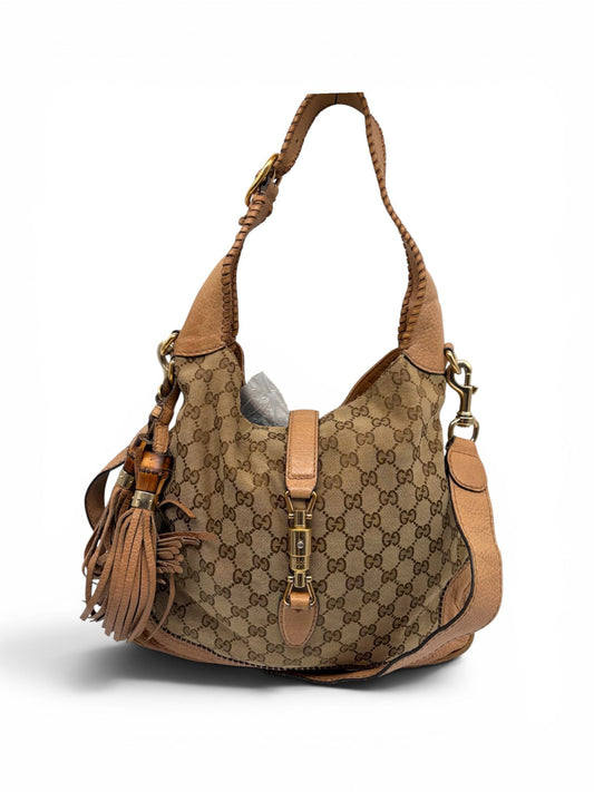 Pre-Loved Gucci New Jackie Schultertasche aus GG Canvas in Beige und Braun mit Bambus-Quasten, exklusiv erhältlich im Titosarchivee Designer Vintage Shop.